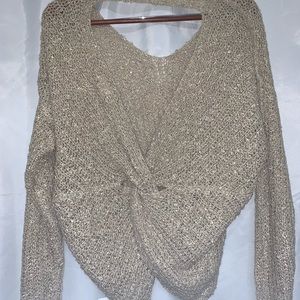 Tan sweater type top with opening in the back, NWT